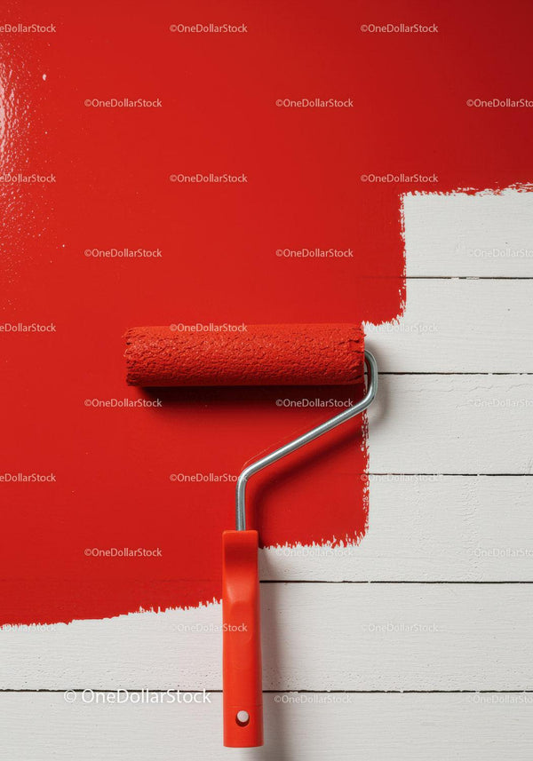 Red Paint Application on White Wooden Wall with Paint Roller