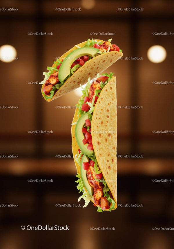 Fresh chicken tacos with avocado and lettuce filling