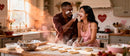 Couple Baking Heart-Shaped Cookies with Playful Flour Fun