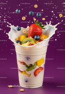 Fresh fruit parfait with yogurt splash on purple background