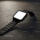 Modern black smartwatch with blank screen on gray surface