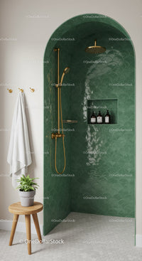 Minimalist shower niche with emerald green tiles and gold fixtures