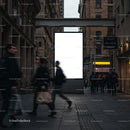 Busy urban street with blank advertising billboard