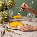 Elegant Lemon Tart on Fine Dining Table with Crystal Glassware