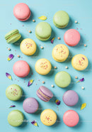 Colorful French macarons with decorative flower petals