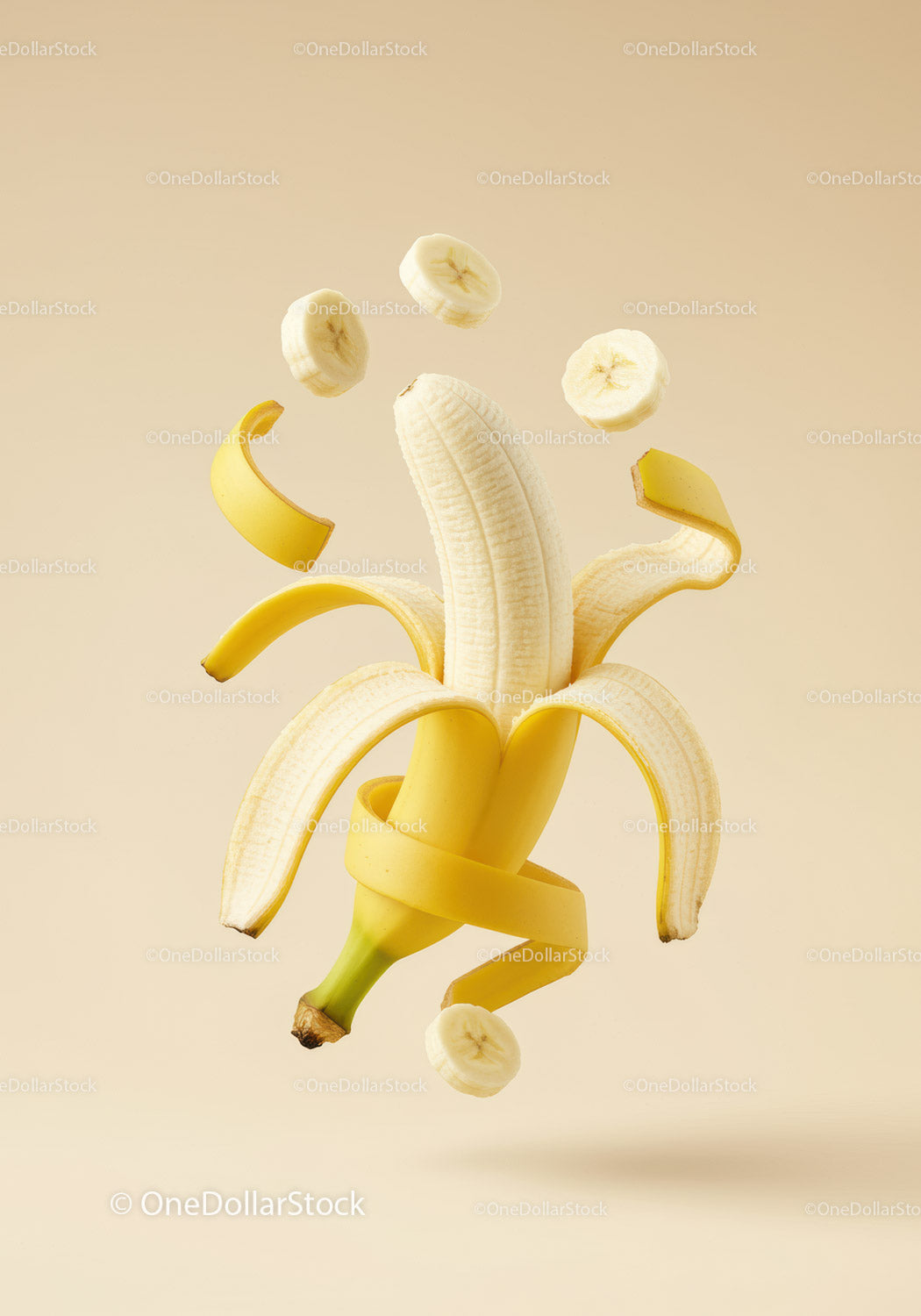 Creative peeled banana with floating slices and peel