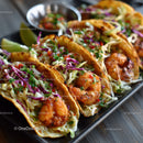 Shrimp Tacos with Fresh Vegetables and Lime on Black Serving Tray