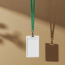 Blank ID Badge with Green Lanyard Hanging on Wall