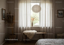 Cozy bedroom corner with natural light and rustic decor