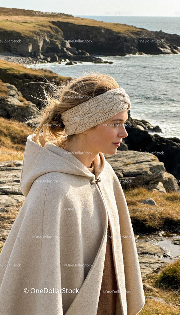 Woman Wearing Knitted Headband and Wool Cape Outdoors
