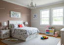 Bright Children's Bedroom with Playful Decor and Natural Sunlight