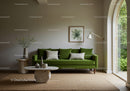 Modern living room with green velvet sofa and natural decor
