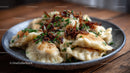 Japanese Gyoza Dumplings with Crispy Edges and Green Garnish