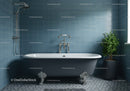 Classic freestanding bathtub in modern blue tiled bathroom