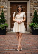 Elegant Woman Walking Outdoors in Summer Dress on City Street