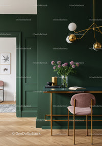 Elegant Green Accent Wall Dining Area with Stylish Lighting and Floral Decor
