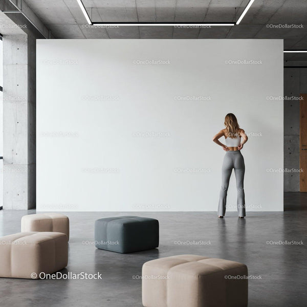 Woman standing contemplatively in modern minimalist space JPG Mockup Image
