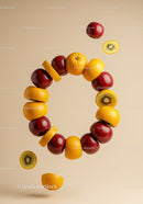 Floating ring of mixed fresh fruits in beige studio