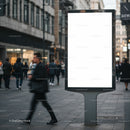Busy urban street with blank digital billboard display