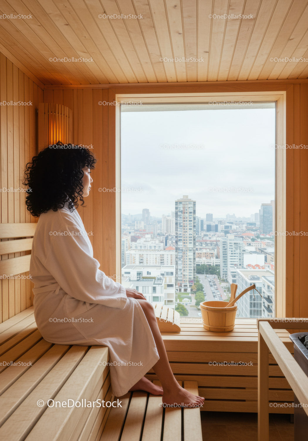 Woman Sitting in Traditional Sauna with City View Above Skyscrapers