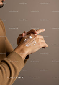 Man Applying Moisturizer on Hands for Healthy Skin