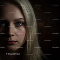 Close up portrait of blonde woman with intense blue eyes