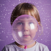 Child with translucent balloon against purple background