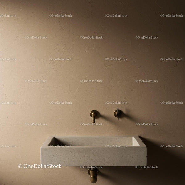 Nowoczesna beżowa łazienka z baterią ścienną i ceramiczną umywalką
