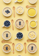 Flat lay of healthy breakfast bowls with fruits and grains