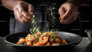 Gourmet Prawns Seasoning in a Black Bowl for Fine Dining