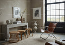 Minimalist living room with leather chair and natural decor