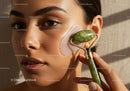 Young Woman Using Jade Roller for Facial Skincare