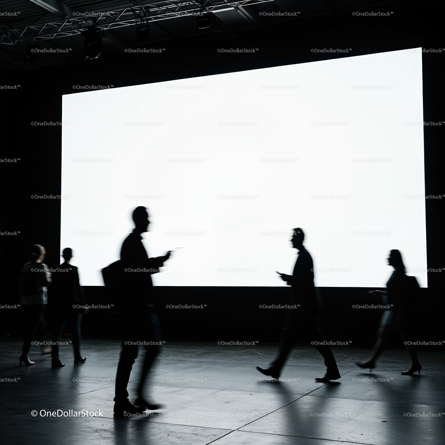 Silhouettes of Business People Walking Past Blank Screen