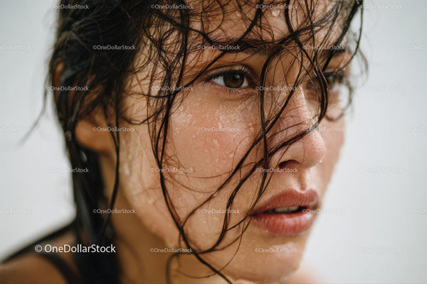 Close-up of Woman with Water Droplets on Skin and Wet Hair