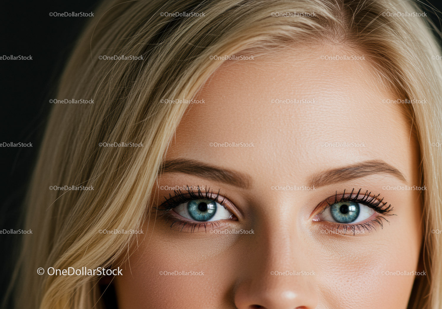 Close up of blue eyes and blonde hair with makeup