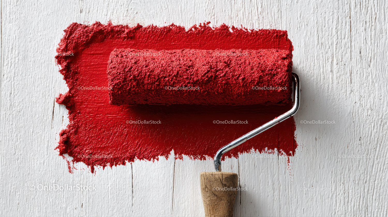 Red Paint and Painting Roller On White Wooden Surface