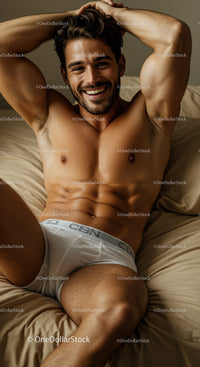 Smiling muscular man relaxing on beige bed in white underwear