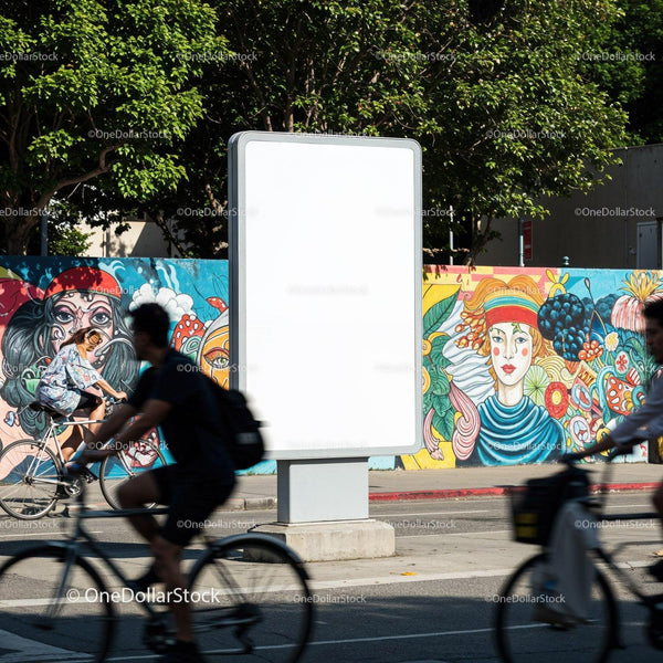 Urban cyclists passing blank billboard with colorful mural JPG Mockup Image