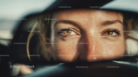 Close-up Portrait of Woman with Green Eyes and Freckles in Outdoor Setting