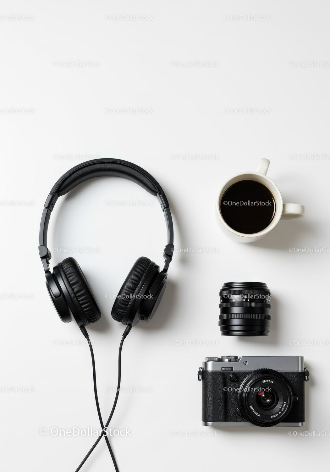 Creative Workspace with Digital Camera Headphones and Coffee Mug