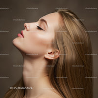 Profile of serene woman with flawless skin and makeup