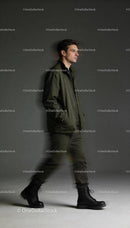 Man walking confidently in casual military-inspired outfit