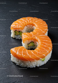 Salmon Sushi Rolls Shaped Like Number Eight on Slate