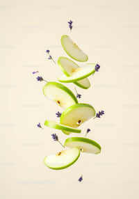 Floating slices of green apple with lavender flowers