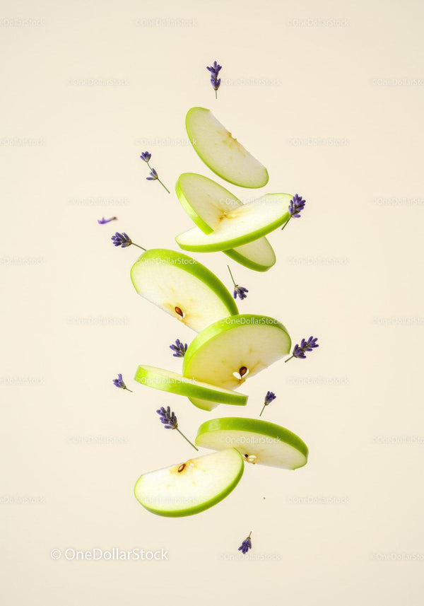 Floating slices of green apple with lavender flowers