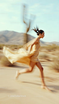 Woman Running in a Desert Landscape with Cacti