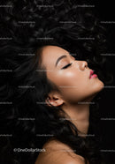 Profile of serene woman with flowing curly hair