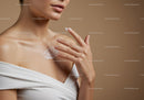 Close Up of Woman Applying Moisturizing Cream to Shoulder