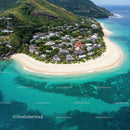 Tropical Island with White Sand Beach and Lush Green Mountains