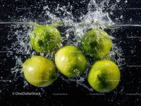 Fresh Ripe Green Apples Splashing into Water with Dynamic Motion